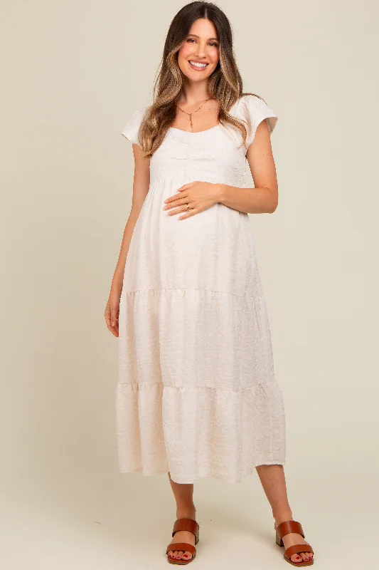Midi dresses with ruched sleeves for a more fitted and stylish arm lookIvory Textured Sweetheart Neck Short Puff Sleeve Tiered Maternity Midi Dress