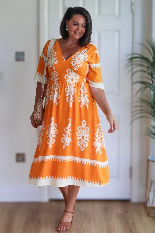 Midi dresses with fringe details for a fun and energetic styleSuzanne Orange Boarder Midi Dress